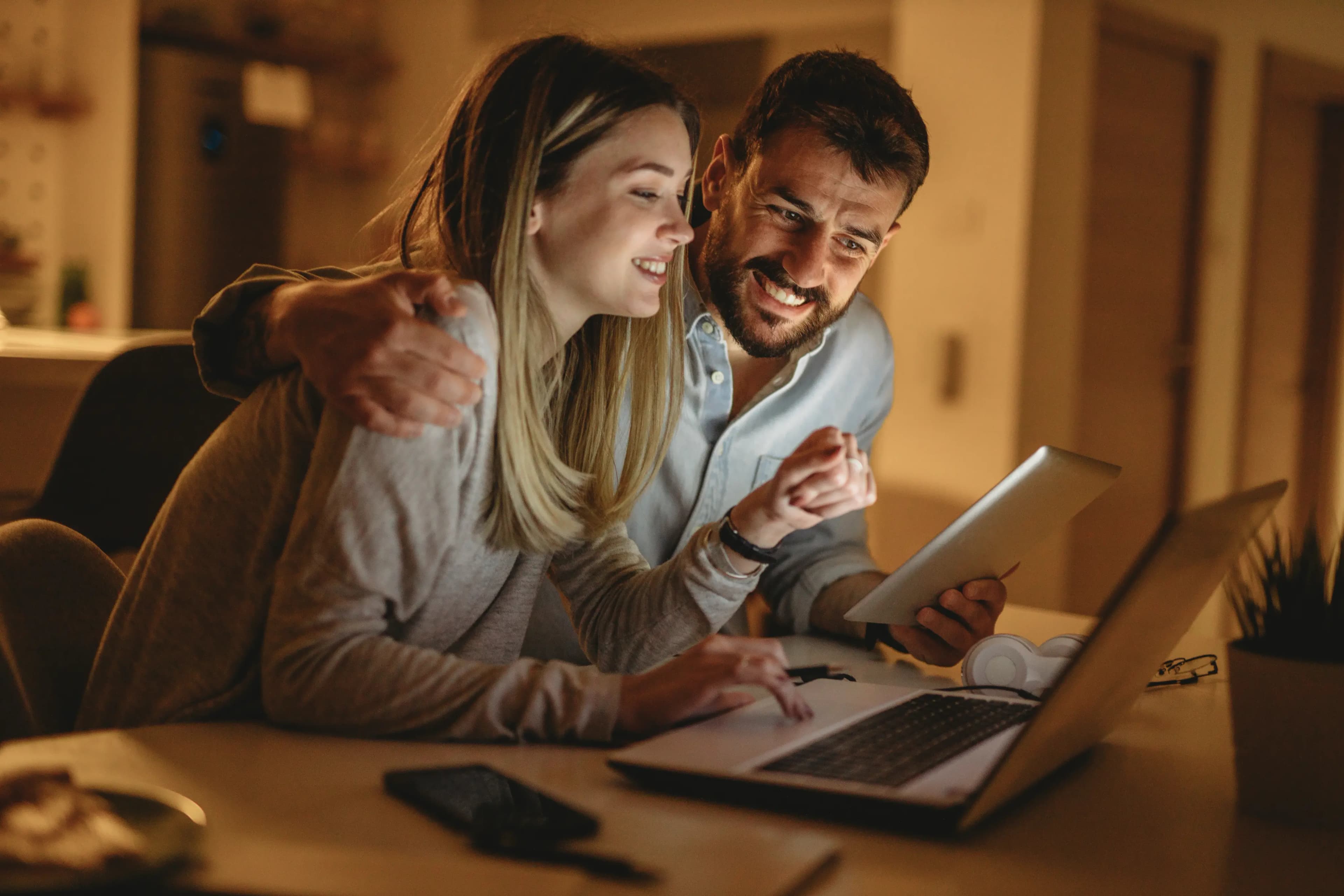 A couple reviewing their finances with a NerdWallet Wealth Partners advisor