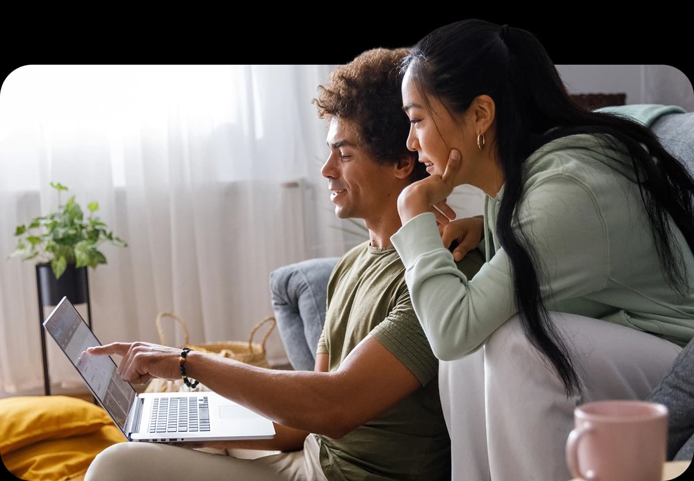 A couple reviewing their finances with a NerdWallet Wealth Partners advisor