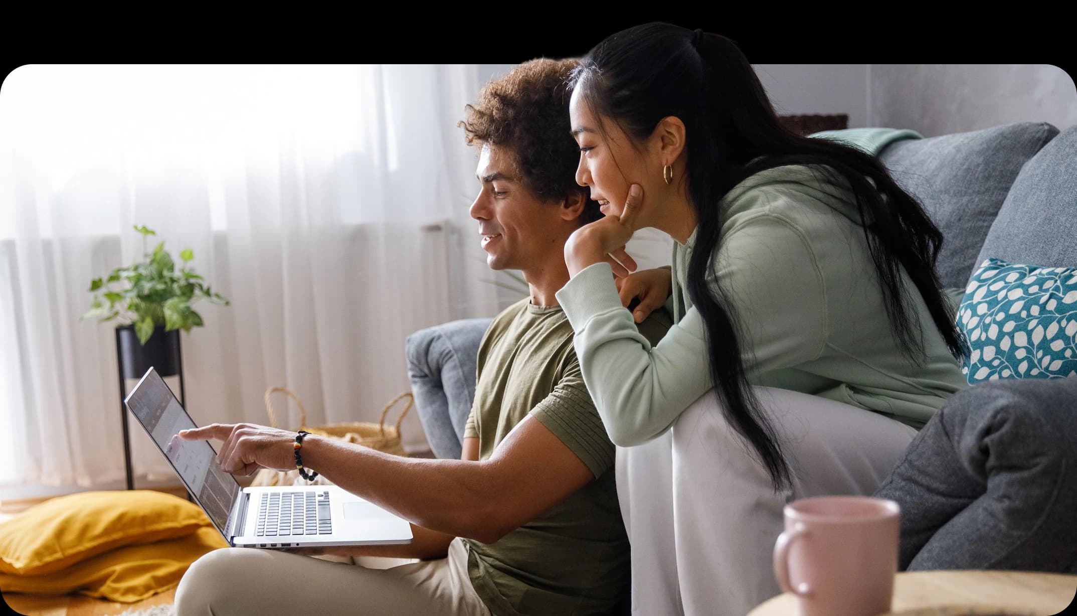 A couple reviewing their finances with a NerdWallet Wealth Partners advisor